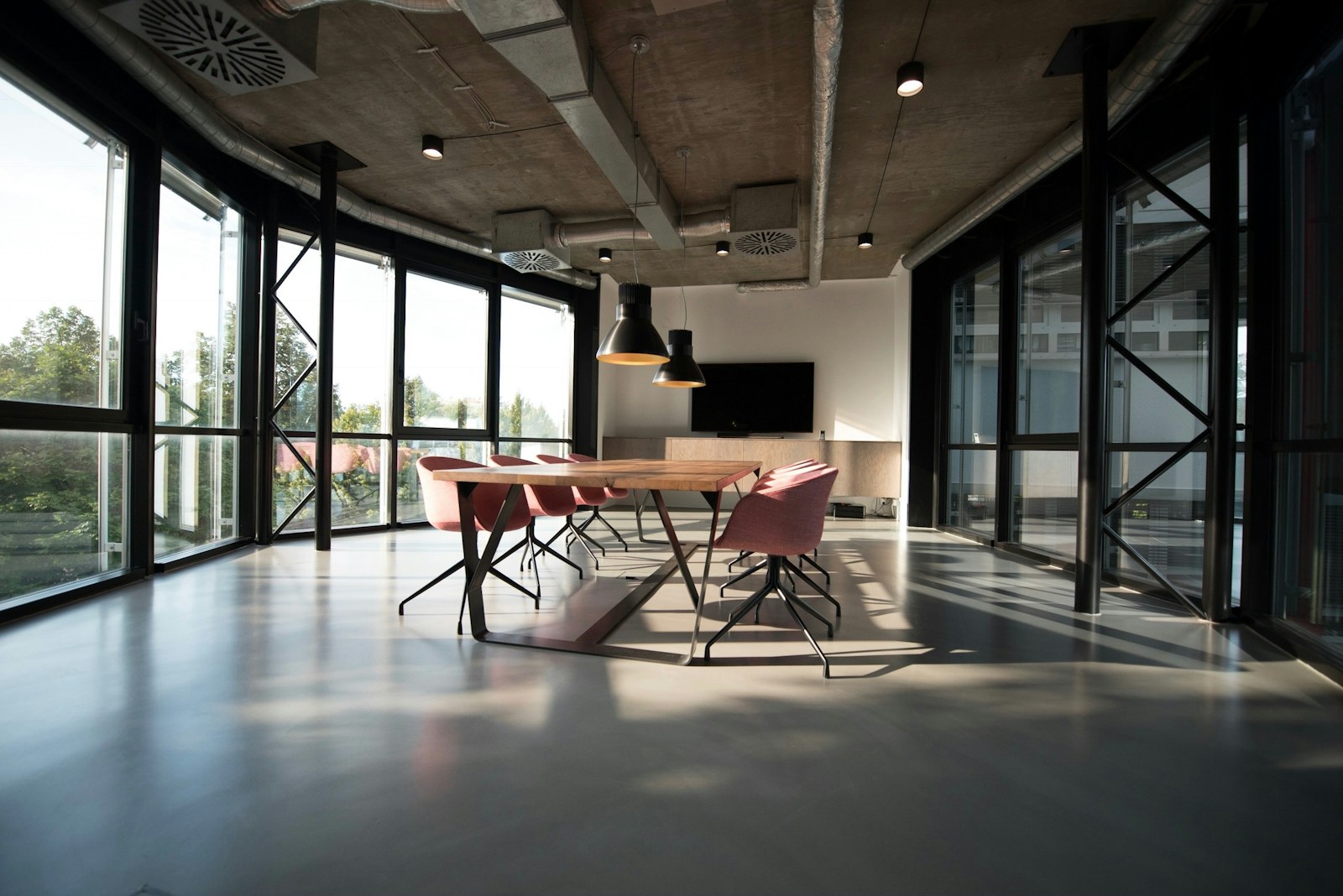 Quiet studio interior with long tables set for a campaign working session